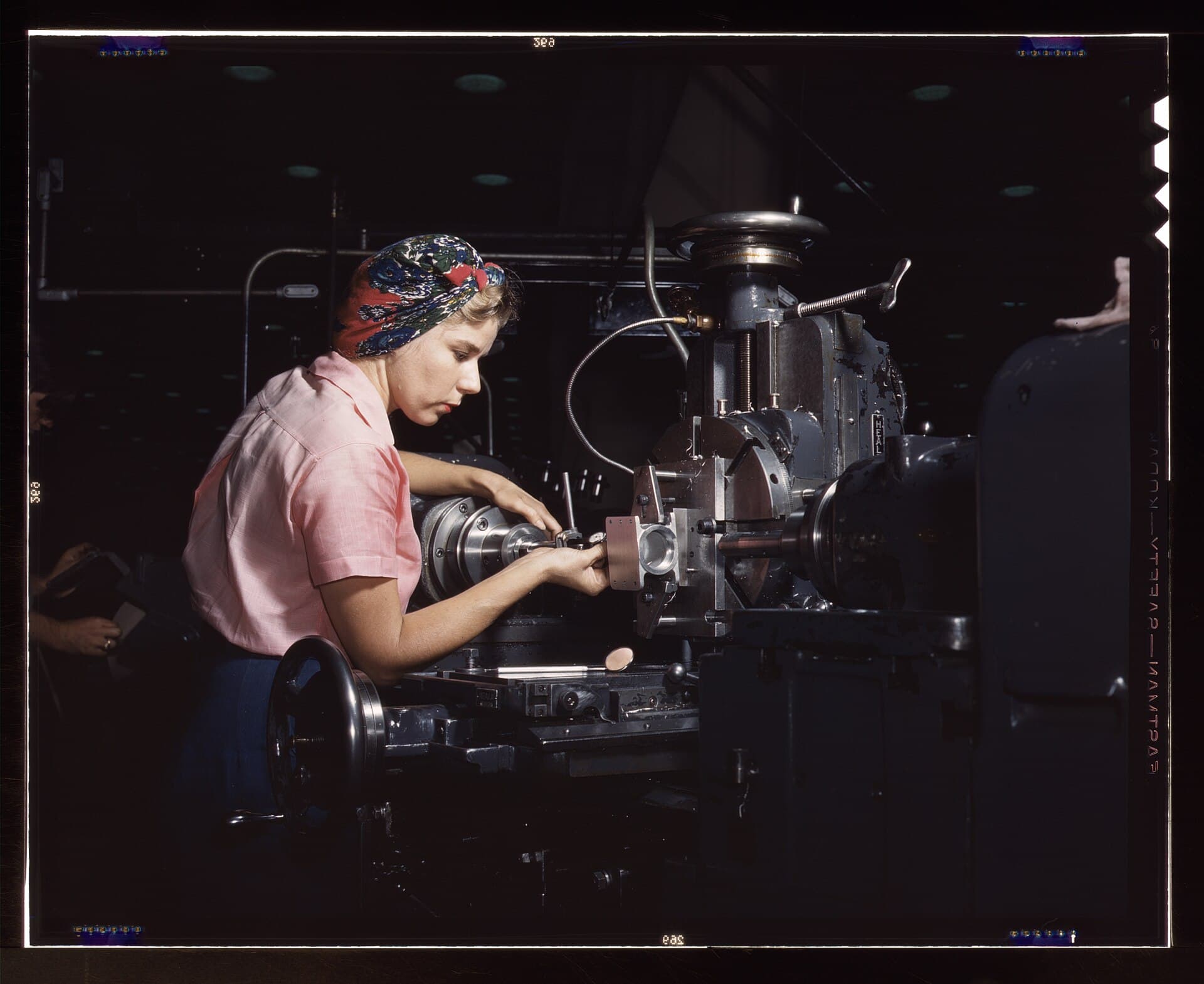 A machinist checking a part with a gauge at Douglas Aircraft Company, Long Beach, 1942